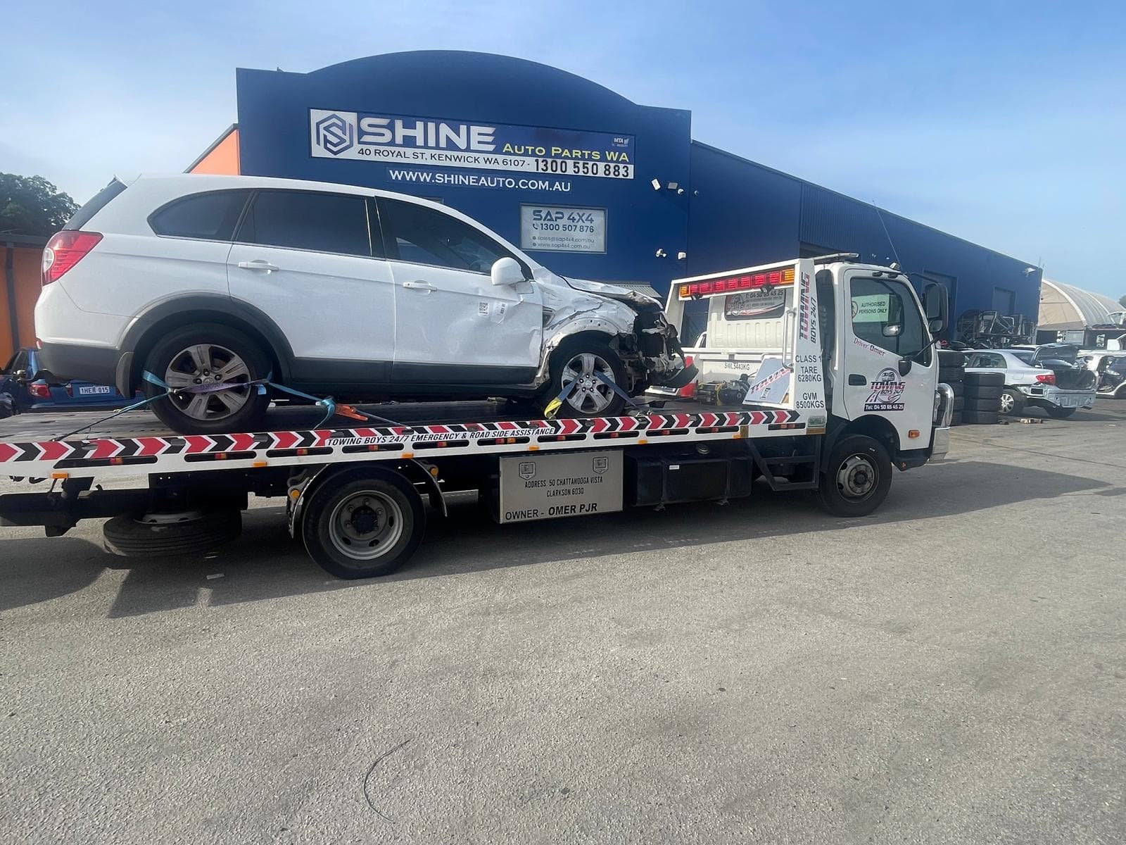 Towing Boys 24/7 recovering a crash-damaged Holden Captiva outside a Perth auto parts yard