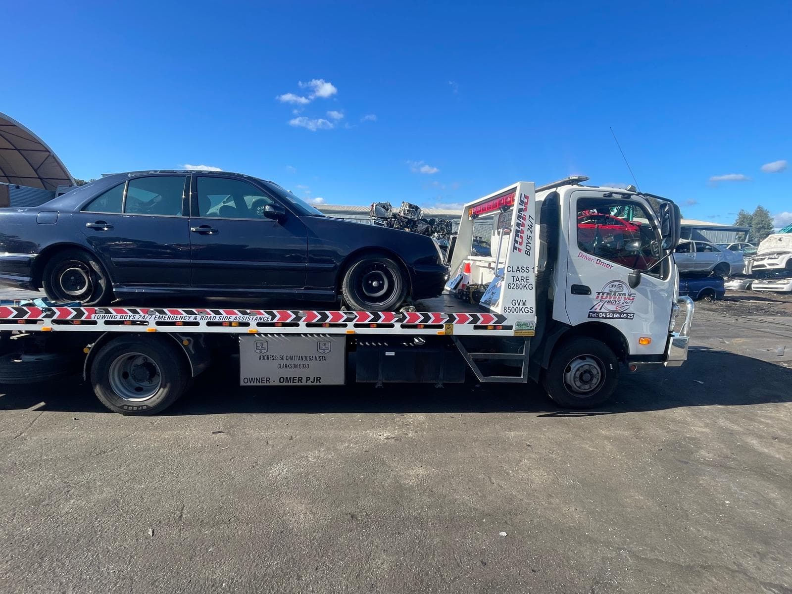 Towing Boys 24/7 truck delivering a Mercedes-Benz sedan to a Perth wrecking yard